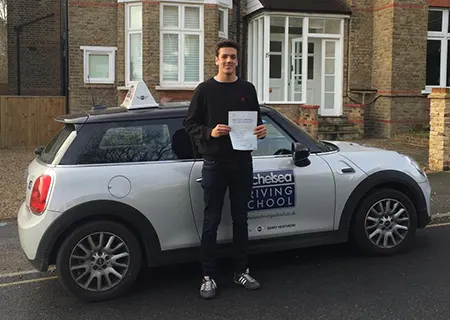 Learner driver in Chelsea Driving School car during lesson in West London
