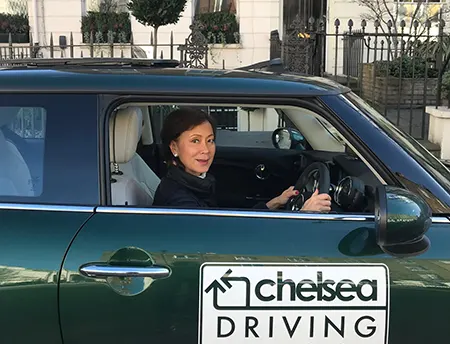 Learner driver in Chelsea Driving School car during lesson in West London