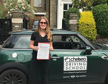 Learner driver in Chelsea Driving School car during lesson in West London